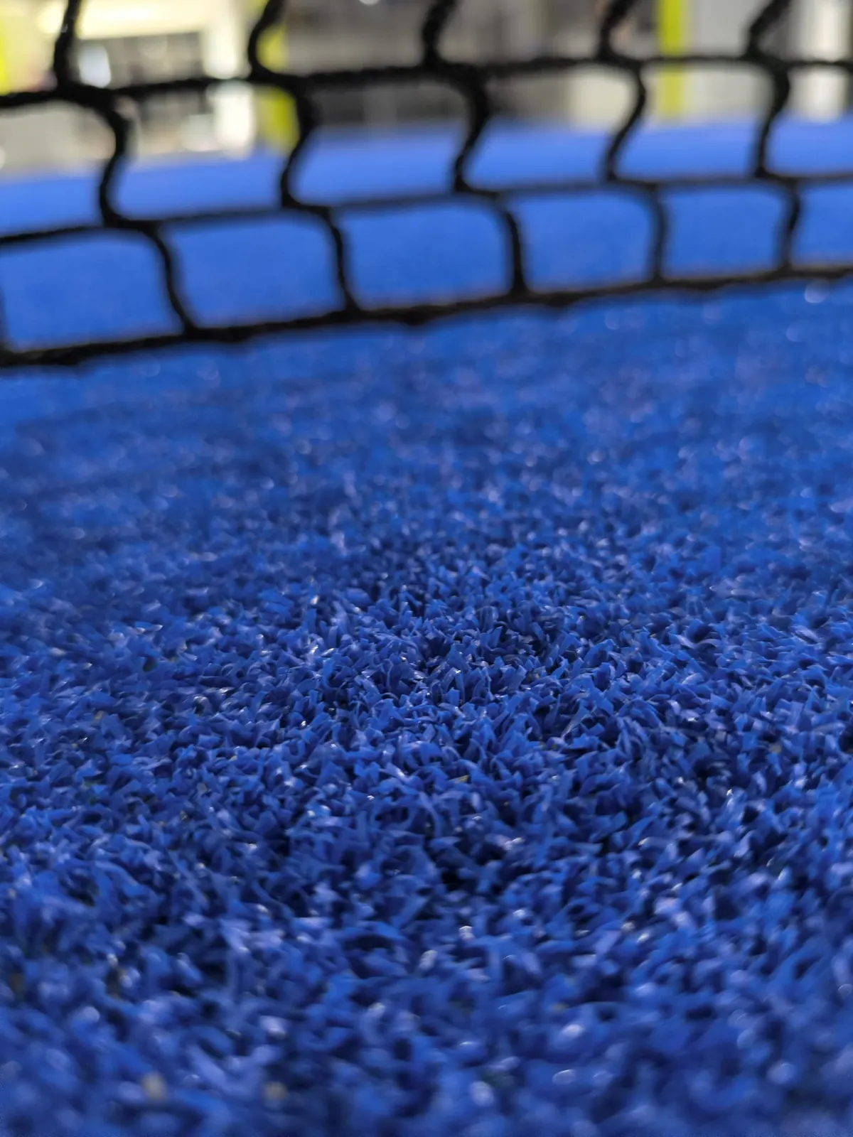 Césped azul de la pista
